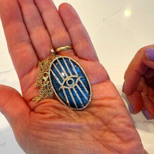 Large labradorite evil eye pendant by Paris jewelry designer Shirel Bellaiche.